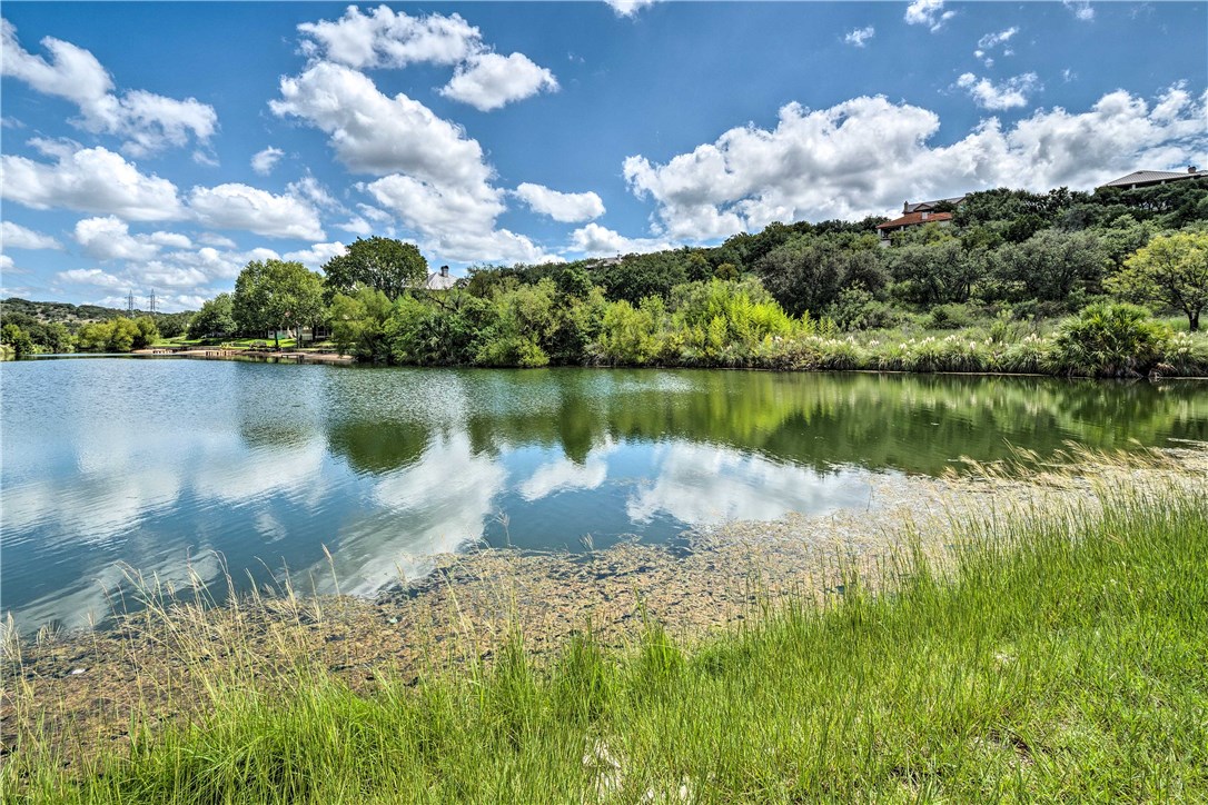 307 Poker Chip, Unit 122 Horseshoe Bay, TX 78657 - Photo 16 of 18 a view of a lake with a yard