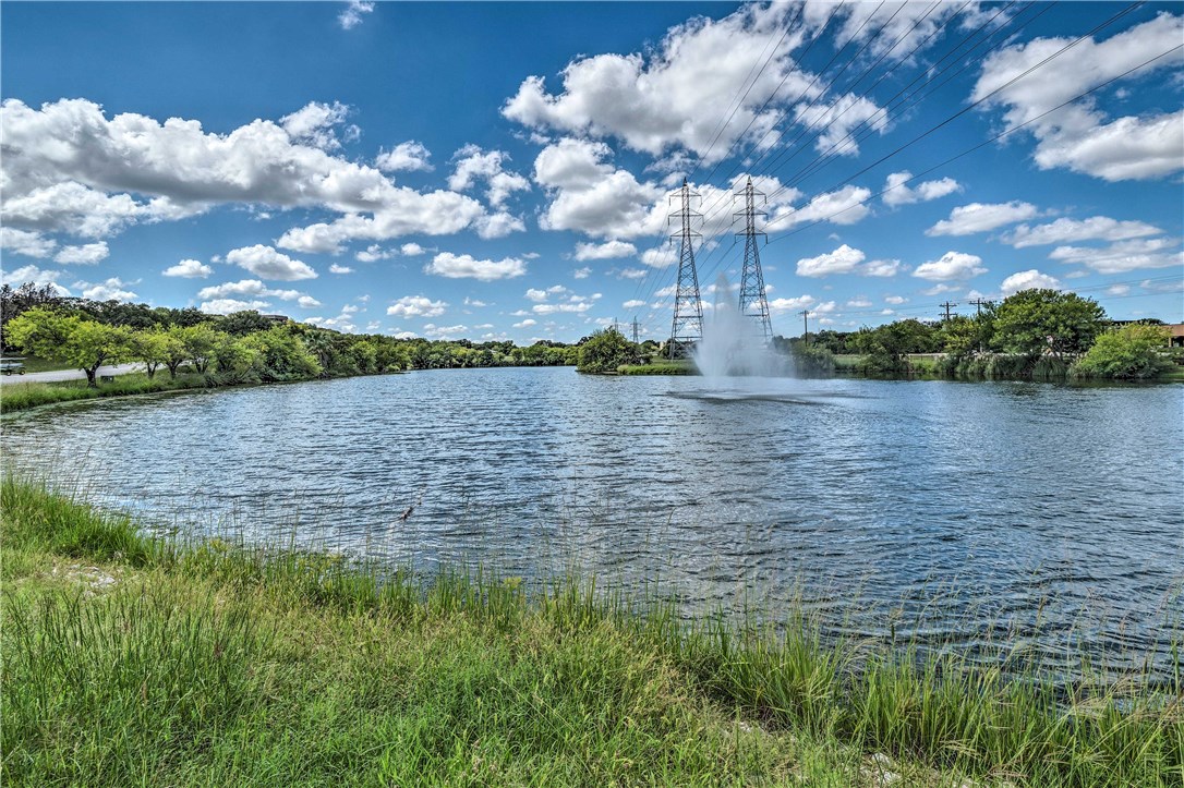307 Poker Chip, Unit 122 Horseshoe Bay, TX 78657 - Photo 17 of 18 a view of a lake from a yard