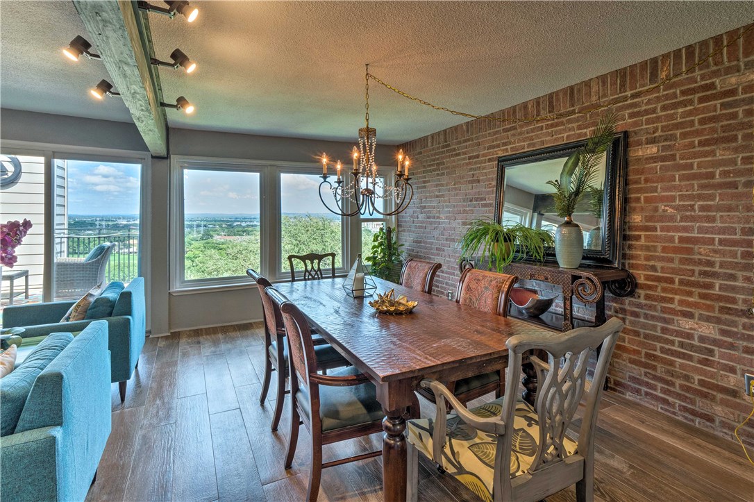 307 Poker Chip, Unit 122 Horseshoe Bay, TX 78657 - Photo 2 of 18 a view of a dining room with furniture window and outside view