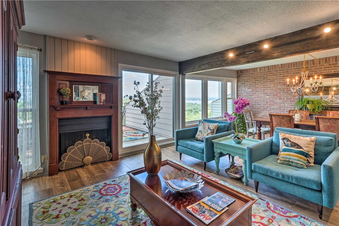 307 Poker Chip, Unit 122 Horseshoe Bay, TX 78657 - Photo 8 of 18 a living room with furniture and a fireplace