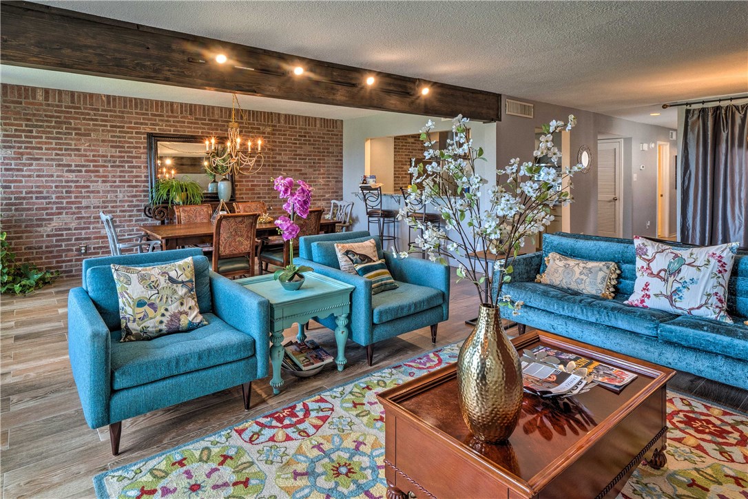 307 Poker Chip, Unit 122 Horseshoe Bay, TX 78657 - Photo 9 of 18 a living room with furniture and a flat screen tv