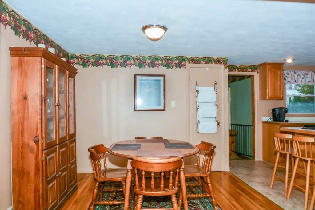 9 Palmer Road Pepperell, MA 01463 - Photo 5 of 29 a view of a dining room with furniture and wooden floor