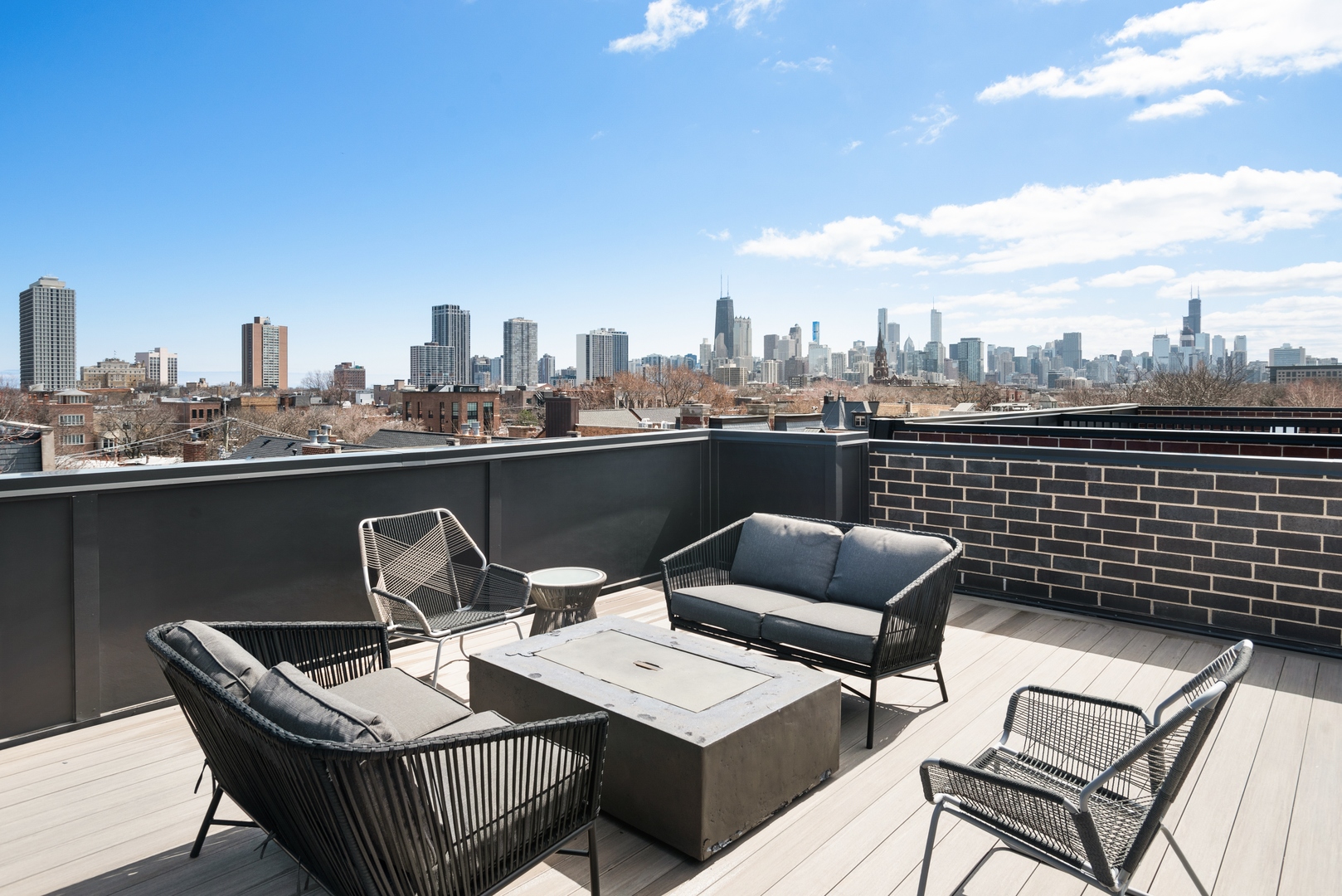 2020 North Howe Street, Unit 3S Chicago, IL 60614 - Photo 29 of 31 a terrace with a couch and wooden floor