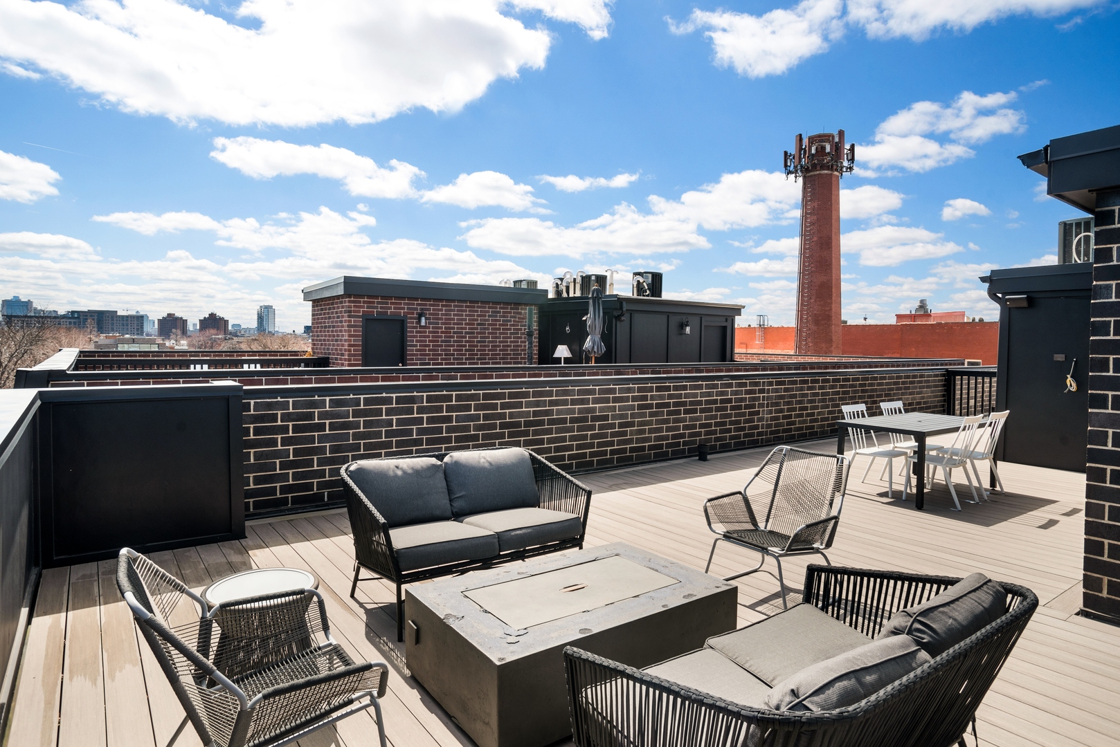 2020 North Howe Street, Unit 3S Chicago, IL 60614 - Photo 30 of 31 a roof deck with couches and potted plants