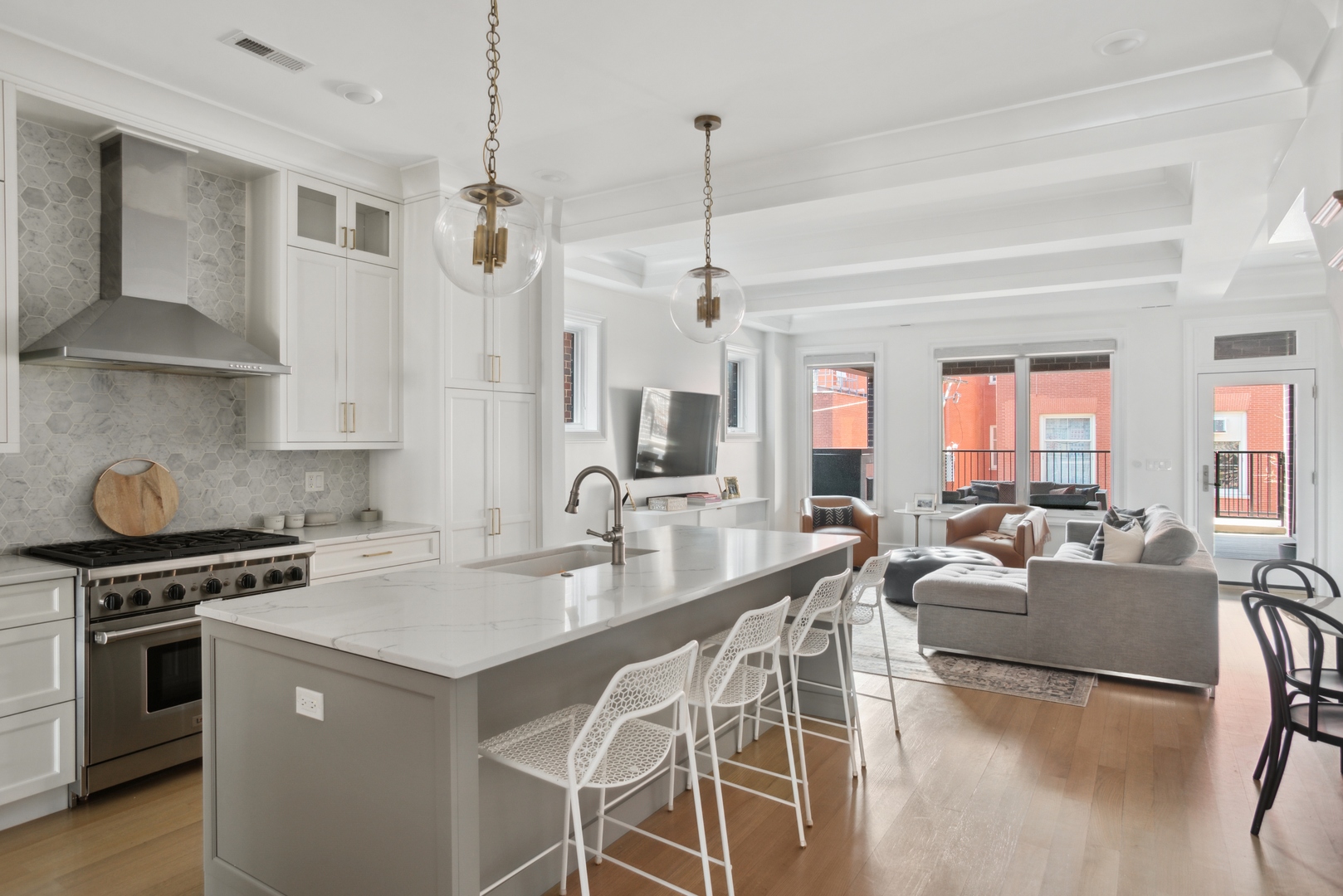 2020 North Howe Street, Unit 3S Chicago, IL 60614 - Photo 8 of 31 a kitchen with stainless steel appliances a stove a sink a dining table and chairs