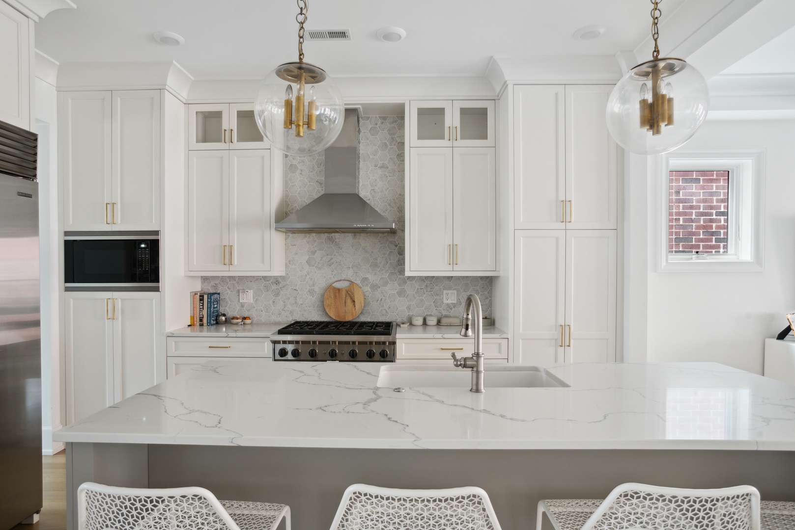 2020 North Howe Street, Unit 3S Chicago, IL 60614 - Photo 10 of 31 a kitchen with stainless steel appliances granite countertop a stove a sink and a white cabinets