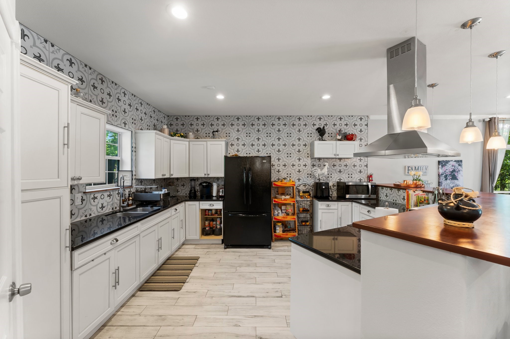 11053 Heritage Ranch Road Conroe, TX 77303 - Photo 13 of 42 a kitchen with refrigerator and cabinets