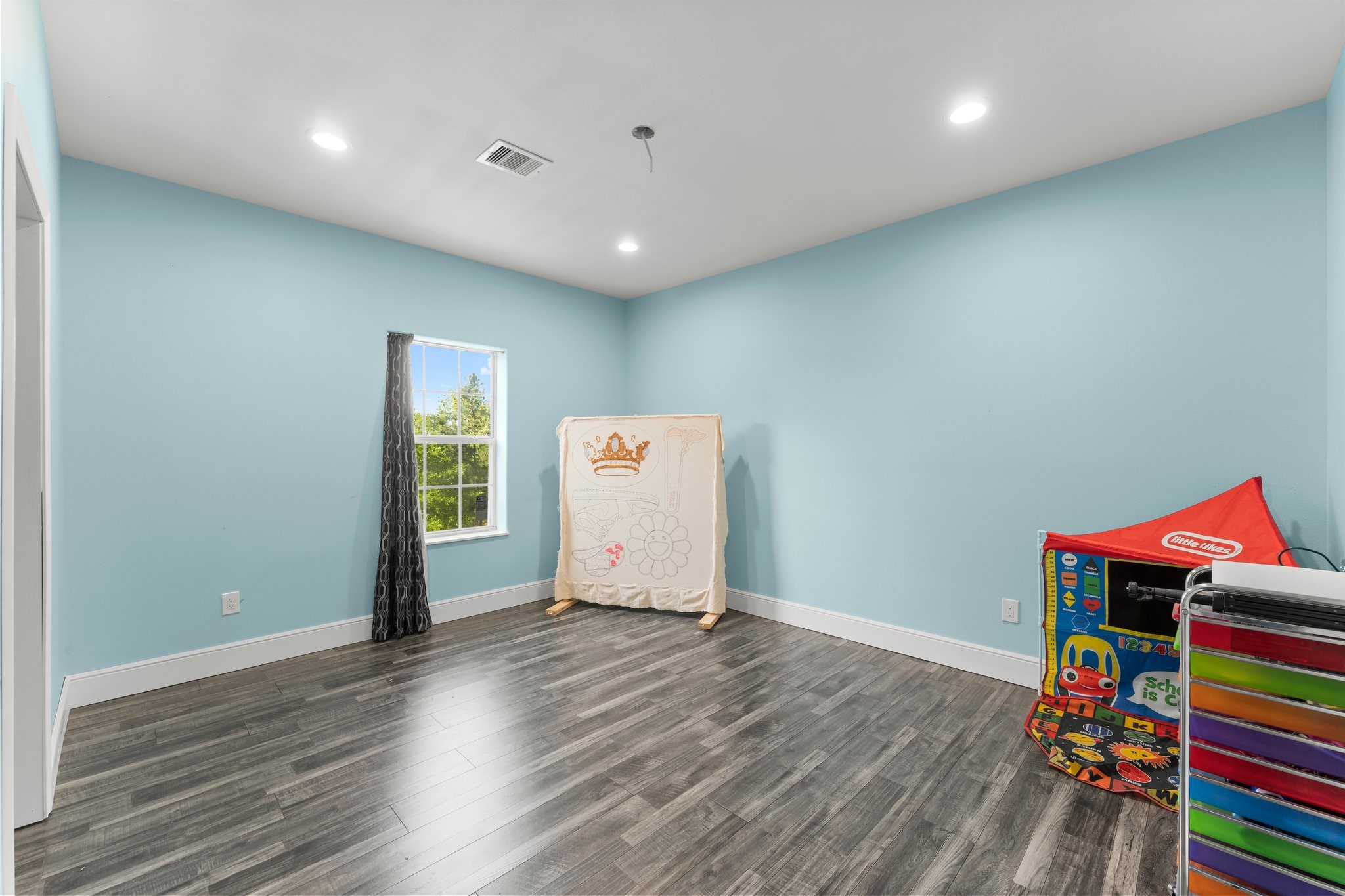 11053 Heritage Ranch Road Conroe, TX 77303 - Photo 26 of 42 a view of an empty room with wooden floor and closet