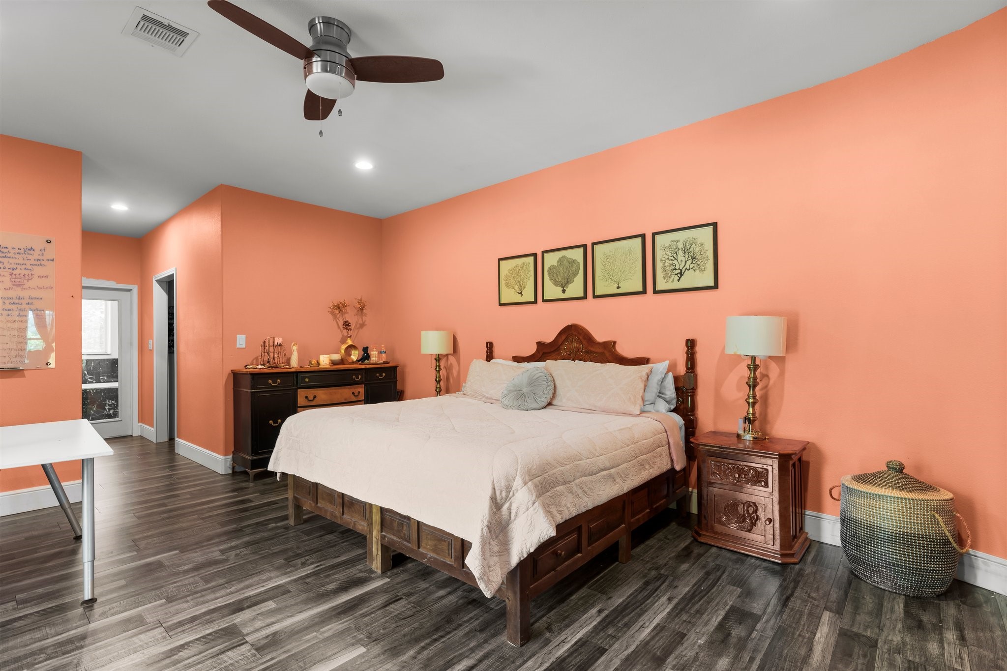 11053 Heritage Ranch Road Conroe, TX 77303 - Photo 29 of 42 a bedroom with a bed and wooden floor