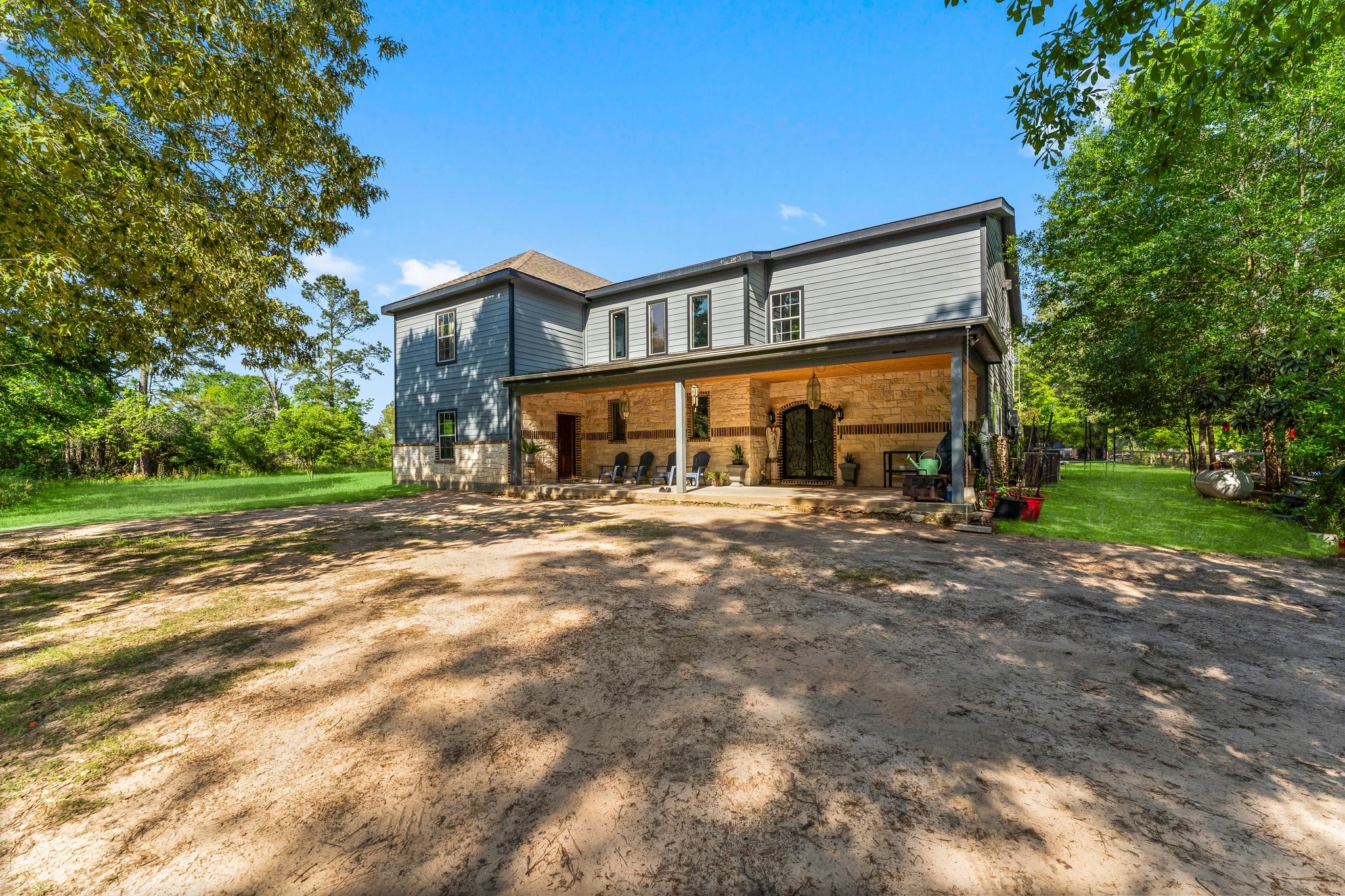11053 Heritage Ranch Road Conroe, TX 77303 - Photo 3 of 42 a front view of a house with a yard