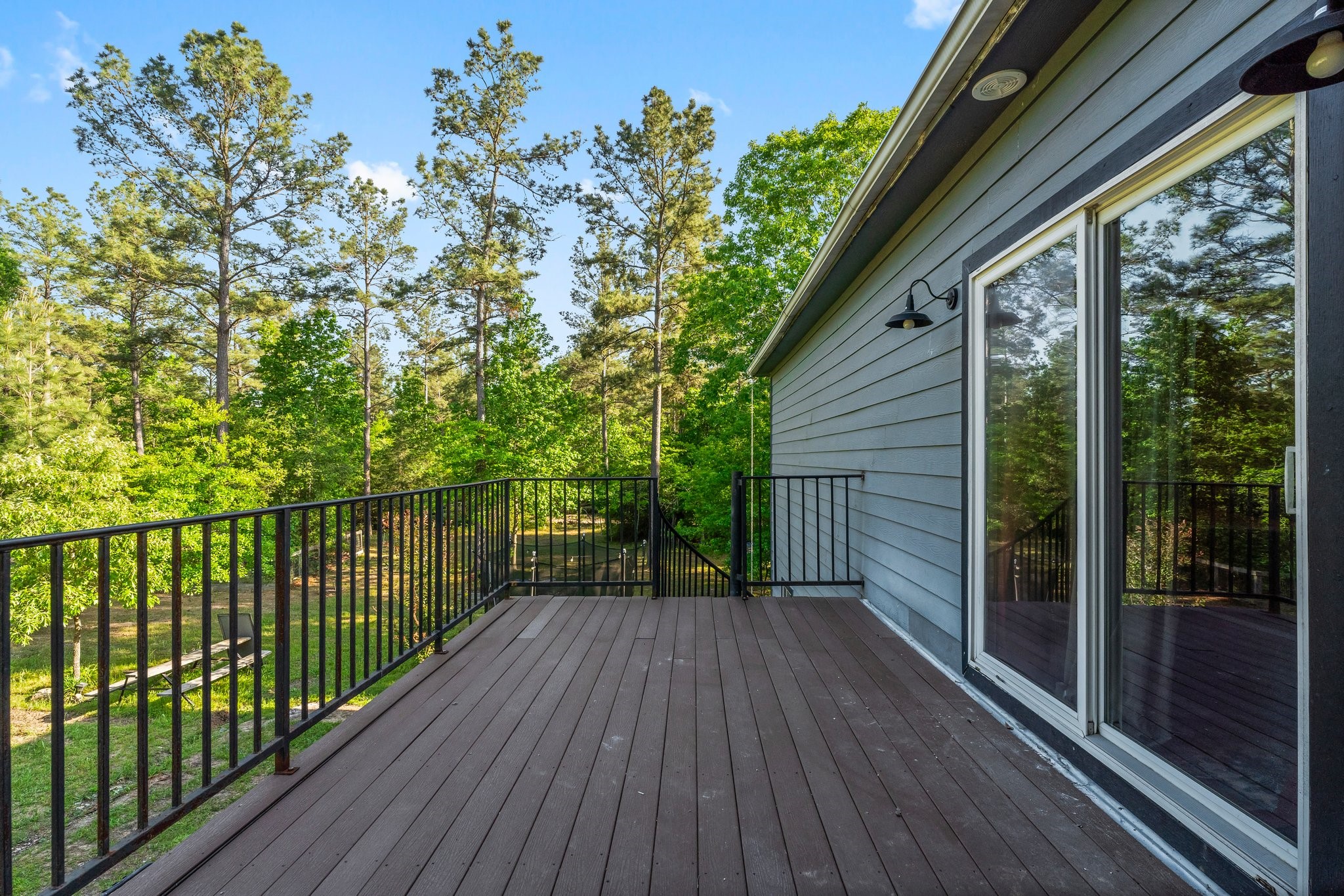 11053 Heritage Ranch Road Conroe, TX 77303 - Photo 32 of 42 a view of backyard with a large trees and wooden fence