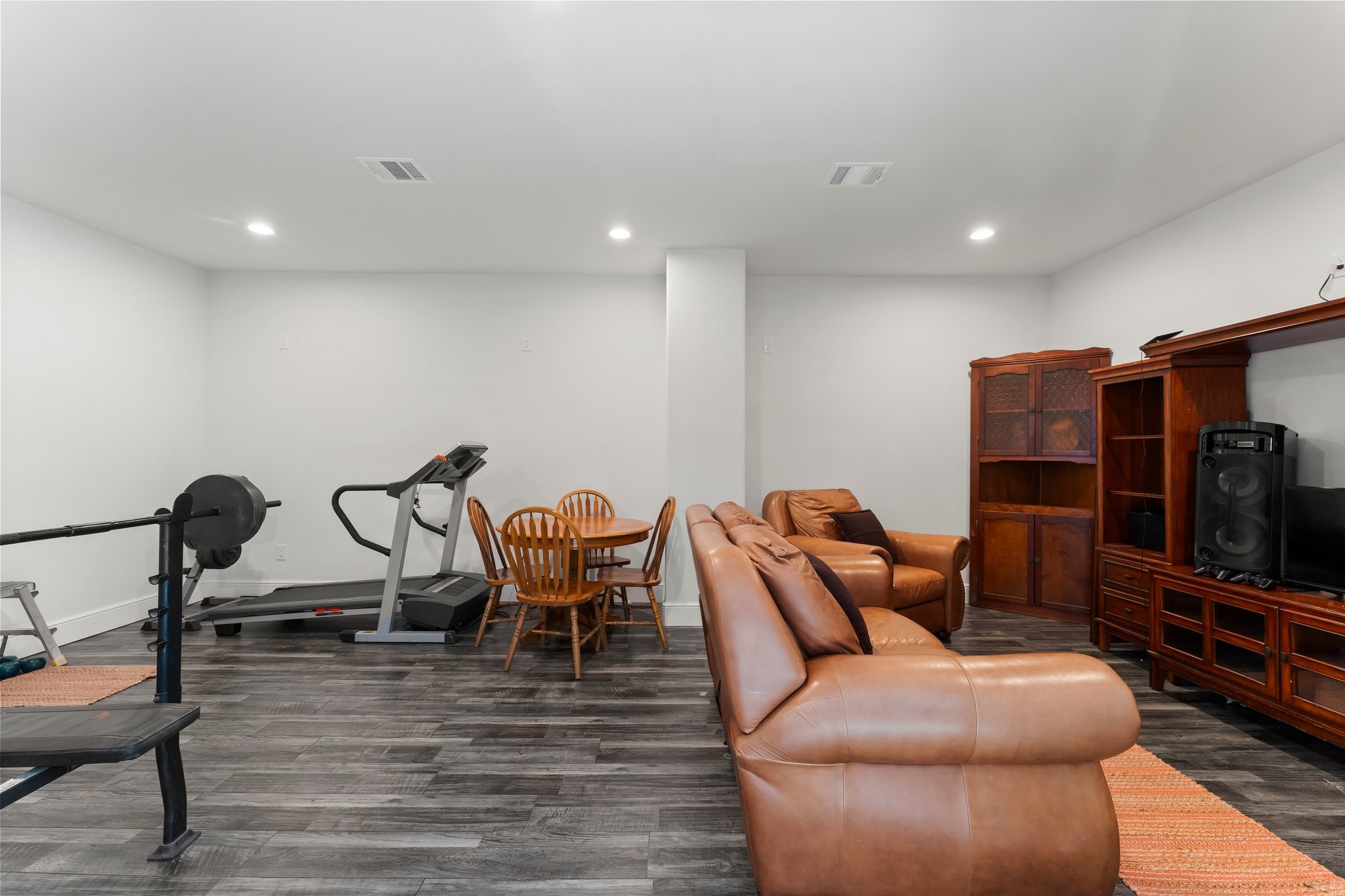 11053 Heritage Ranch Road Conroe, TX 77303 - Photo 34 of 42 a living room with furniture a flat screen tv and a table