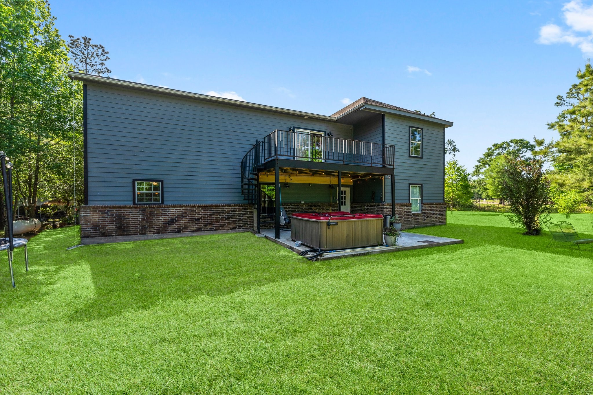 11053 Heritage Ranch Road Conroe, TX 77303 - Photo 36 of 42 a view of a house with a yard