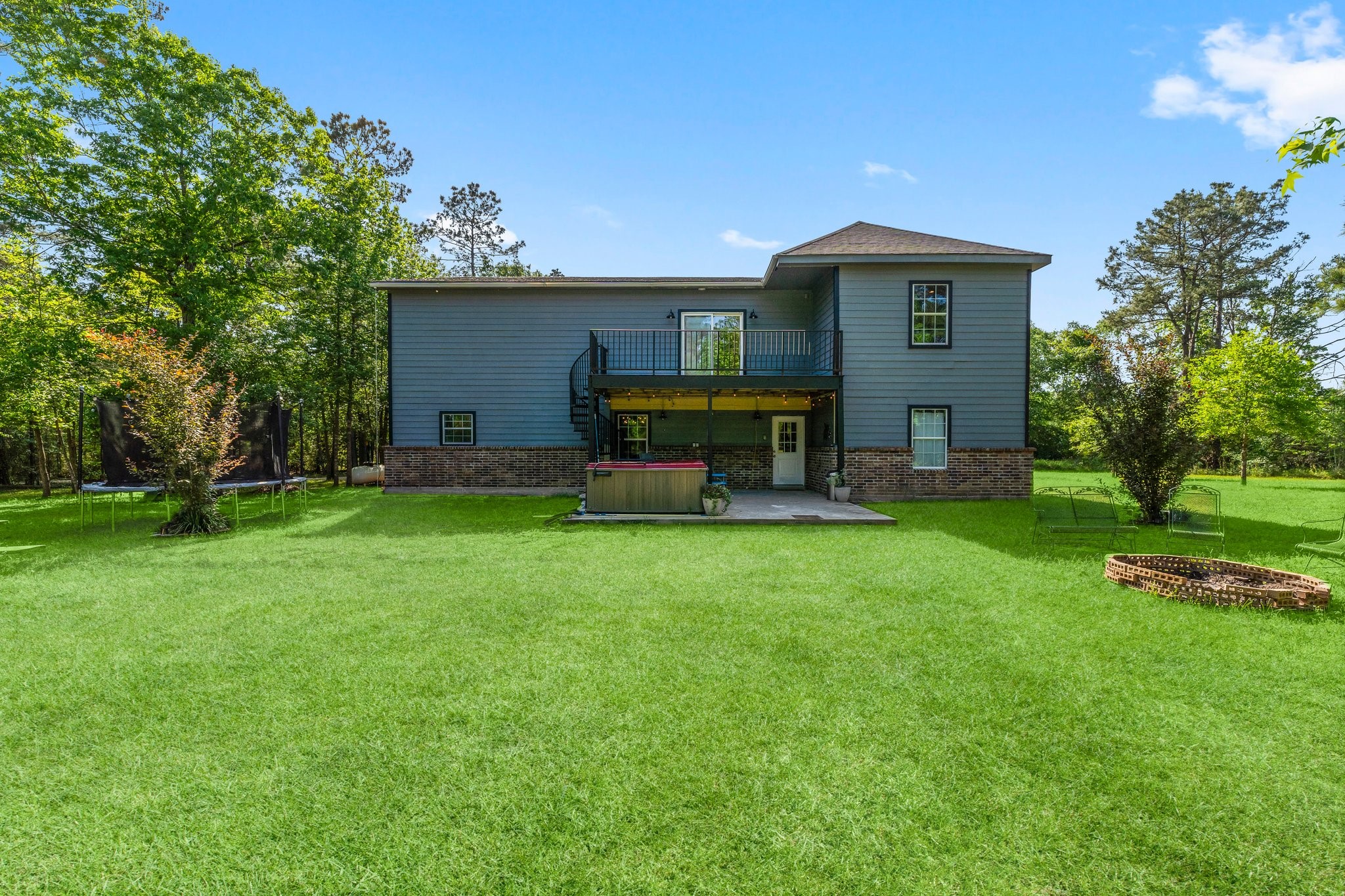 11053 Heritage Ranch Road Conroe, TX 77303 - Photo 37 of 42 a front view of a house with garden