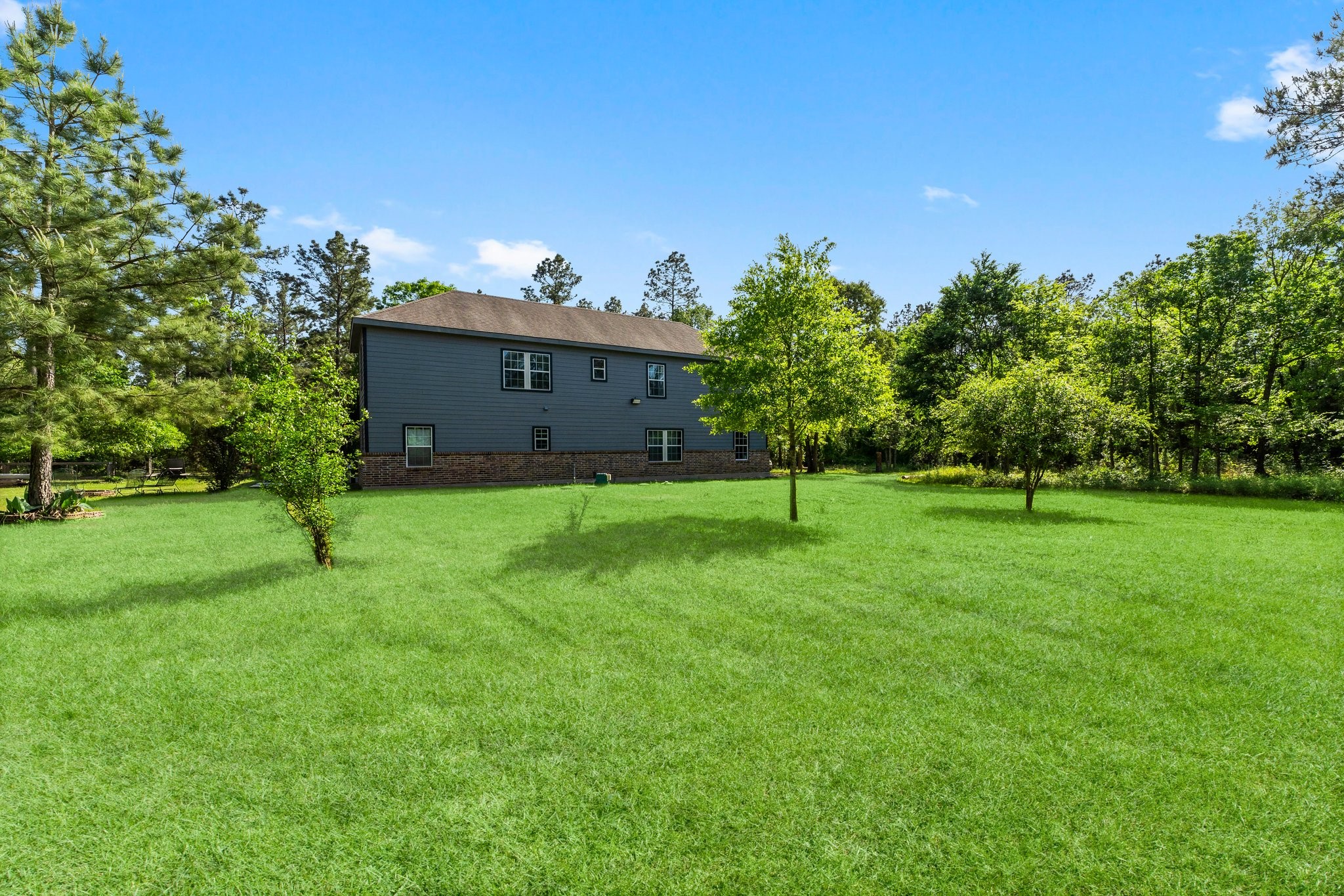 11053 Heritage Ranch Road Conroe, TX 77303 - Photo 38 of 42 a view of a park with a tree in the background