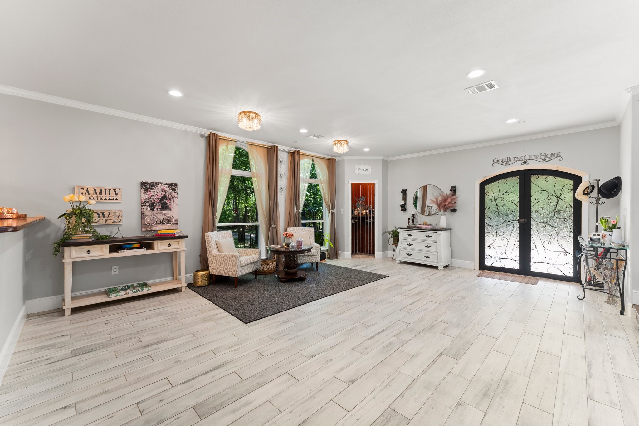 11053 Heritage Ranch Road Conroe, TX 77303 - Photo 7 of 42 a large white room with furniture and a large window