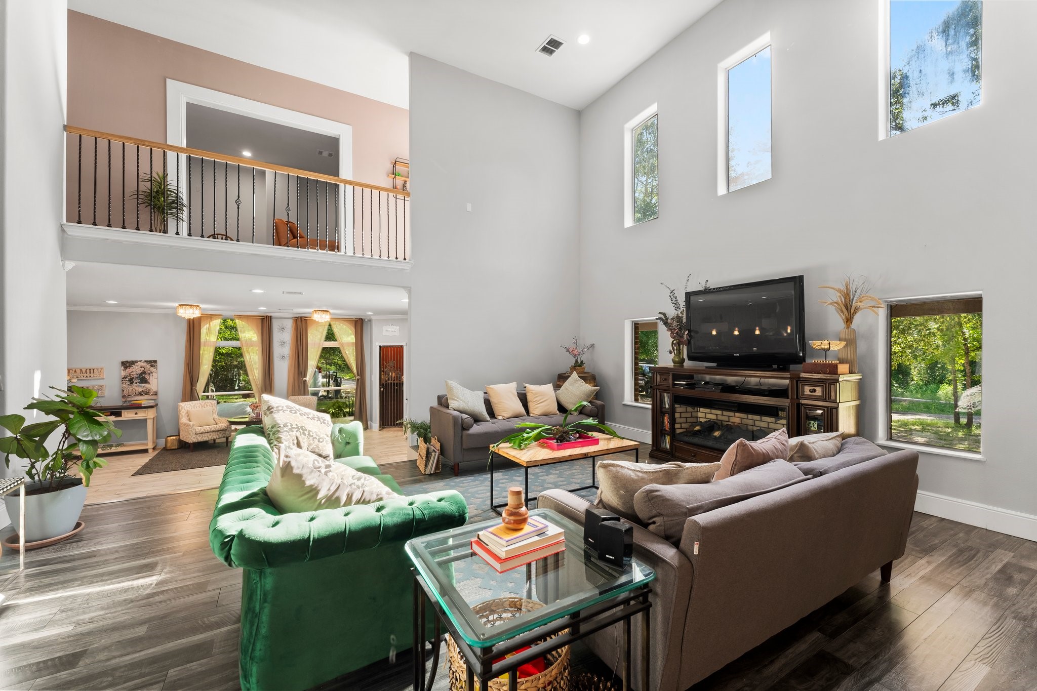 11053 Heritage Ranch Road Conroe, TX 77303 - Photo 10 of 42 a living room with furniture and a flat screen tv