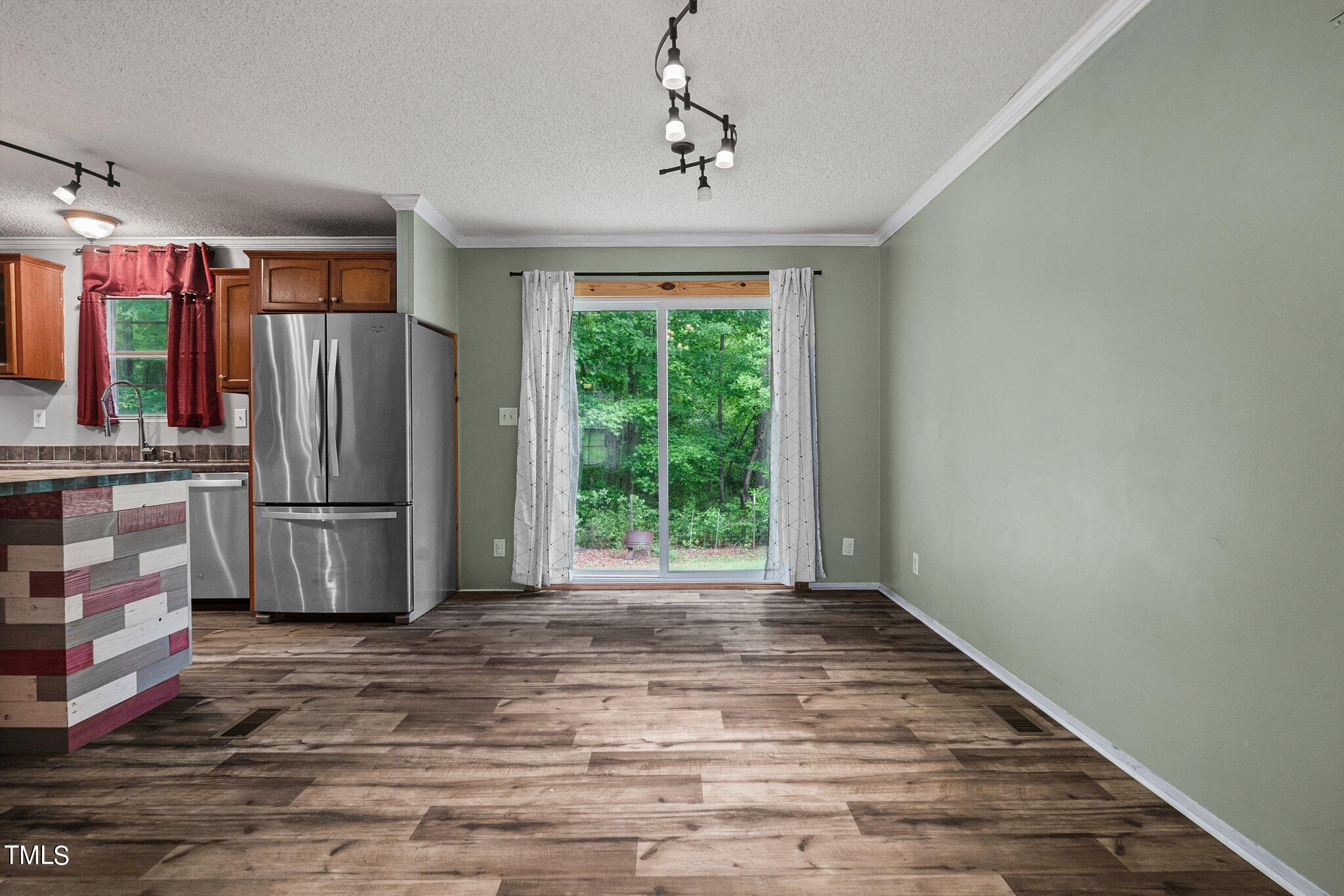 150 Box Elder Terrace Cameron, NC 28326 - Photo 11 of 23 a view of kitchen with stainless steel appliances wooden floor and window