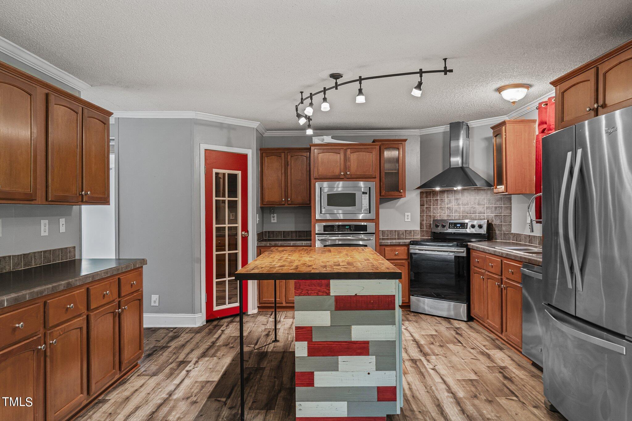 150 Box Elder Terrace Cameron, NC 28326 - Photo 12 of 23 a kitchen with stainless steel appliances granite countertop a sink stove and refrigerator