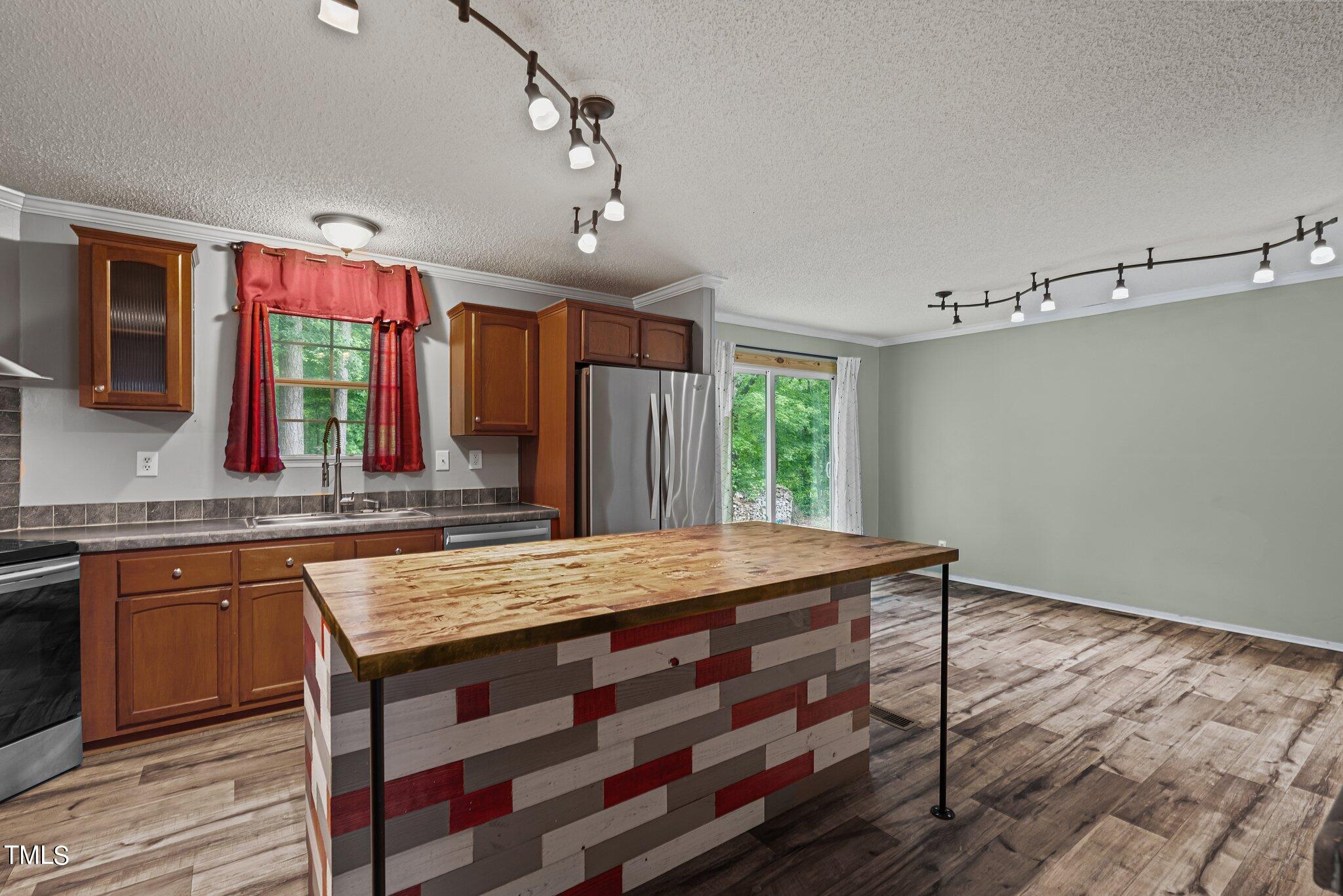 150 Box Elder Terrace Cameron, NC 28326 - Photo 13 of 23 a kitchen with a wooden floor and a view of living room
