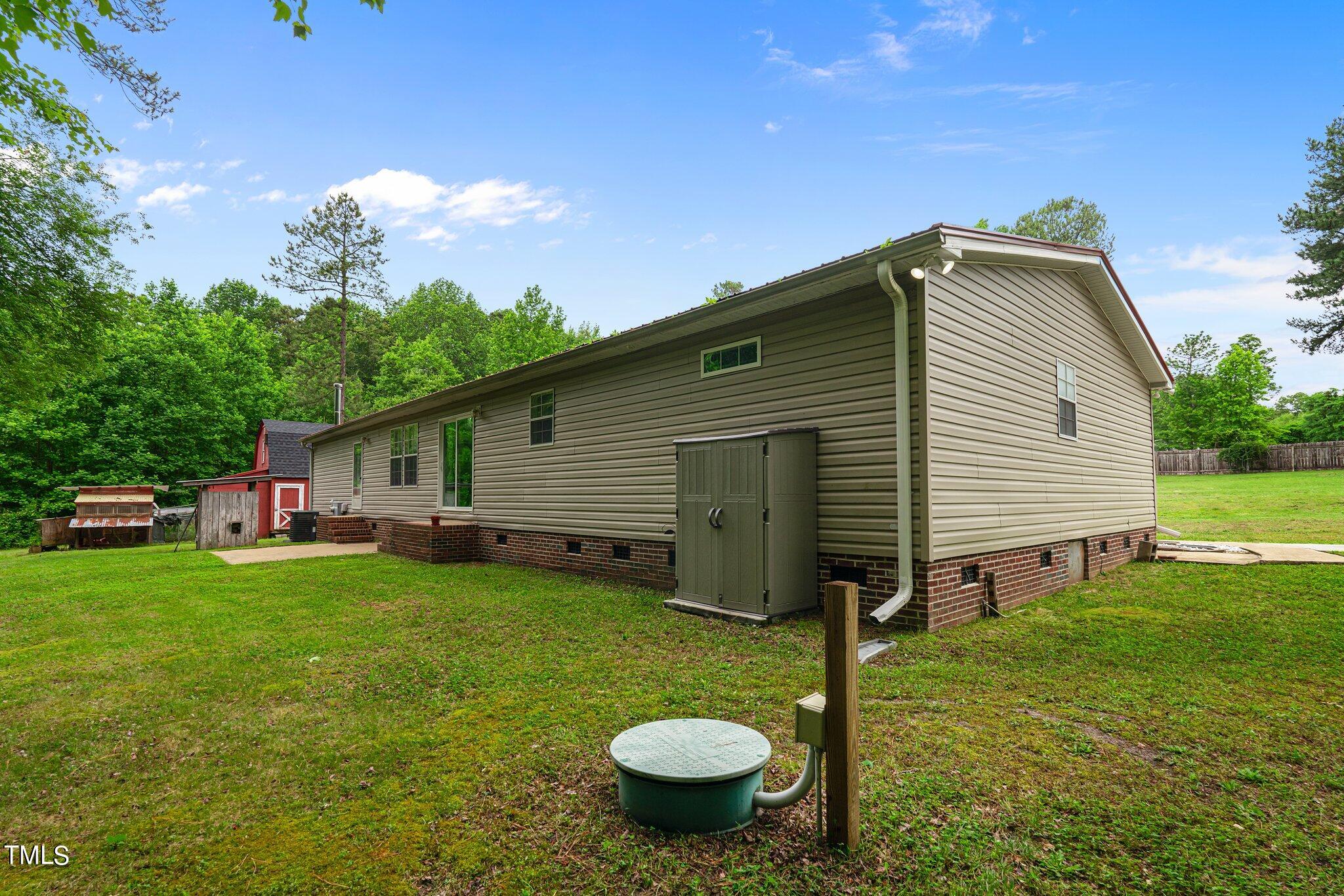 150 Box Elder Terrace Cameron, NC 28326 - Photo 22 of 23 a view of a backyard with a garden