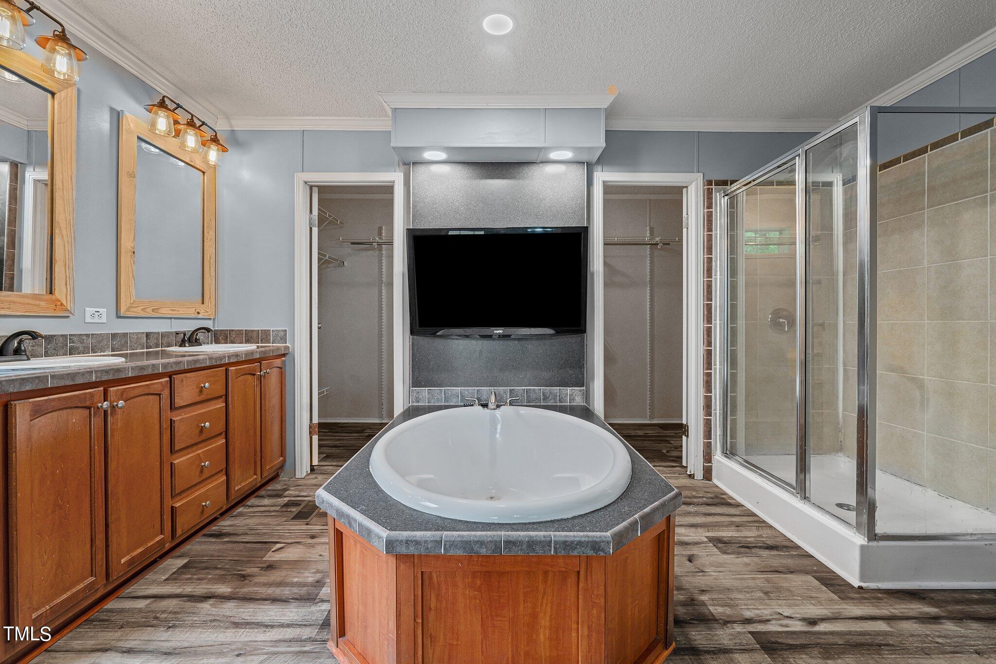 150 Box Elder Terrace Cameron, NC 28326 - Photo 7 of 23 a bathroom with a sink a toilet a mirror and shower