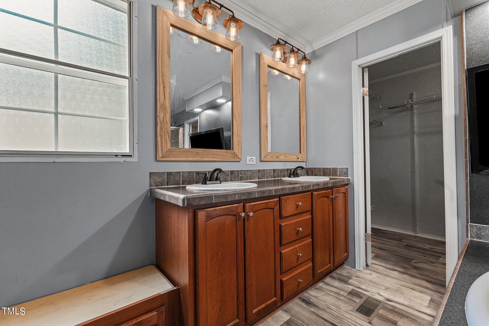 150 Box Elder Terrace Cameron, NC 28326 - Photo 8 of 23 a bathroom with a sink and a mirror
