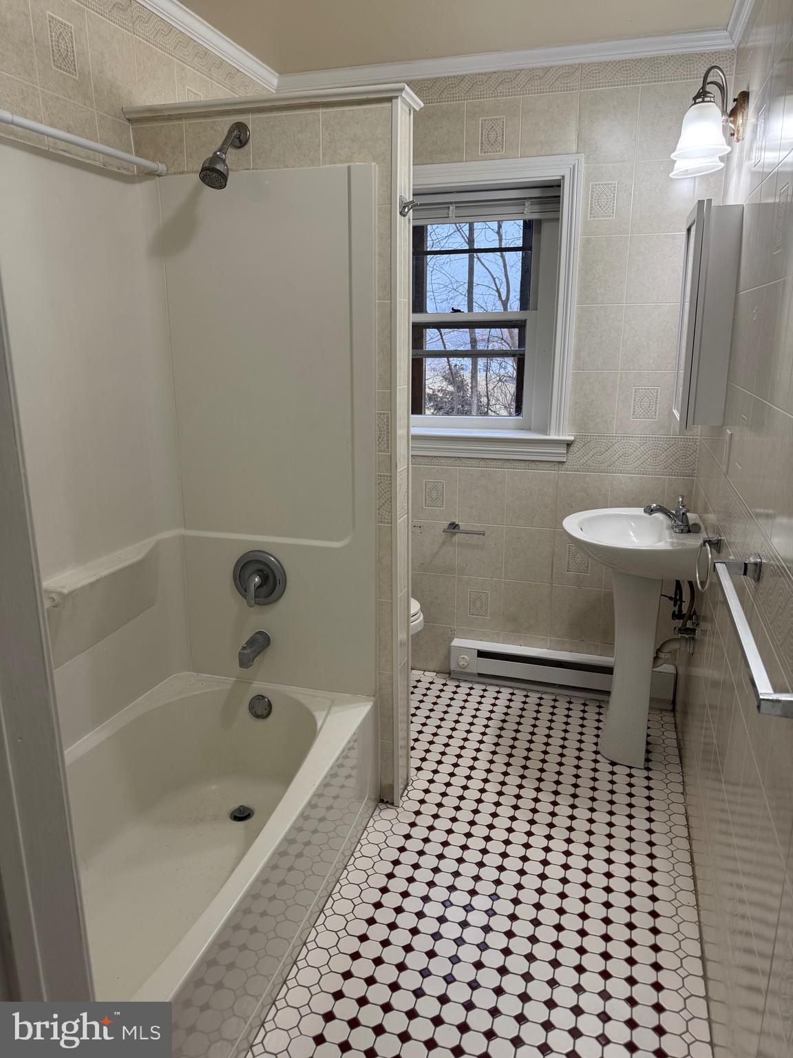 20 Black Horse Road, Unit 5 Paradise, PA 17562 - Photo 5 of 7 a bathroom with a bathtub a shower and a sink