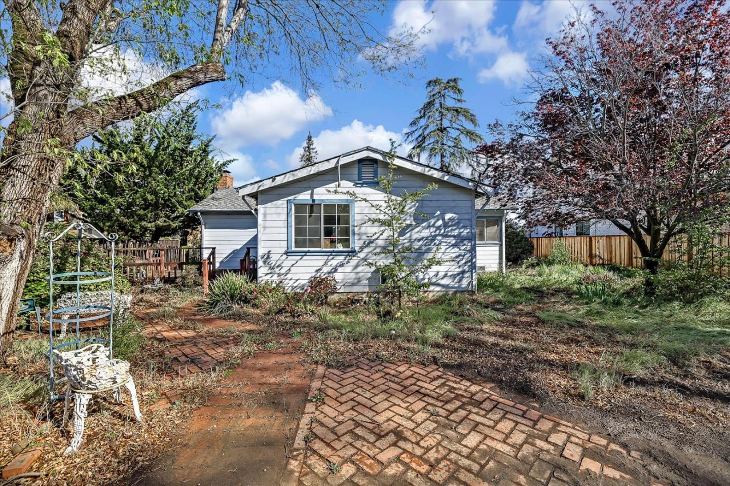 679 Sleeper Avenue Mountain View, CA 94040 - Photo 2 of 51 a front view of a house with a garden