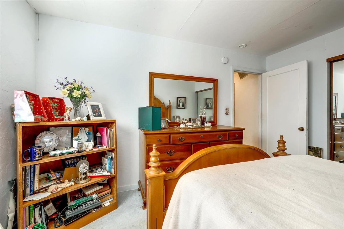 679 Sleeper Avenue Mountain View, CA 94040 - Photo 43 of 51 a bedroom with bed and book shelf