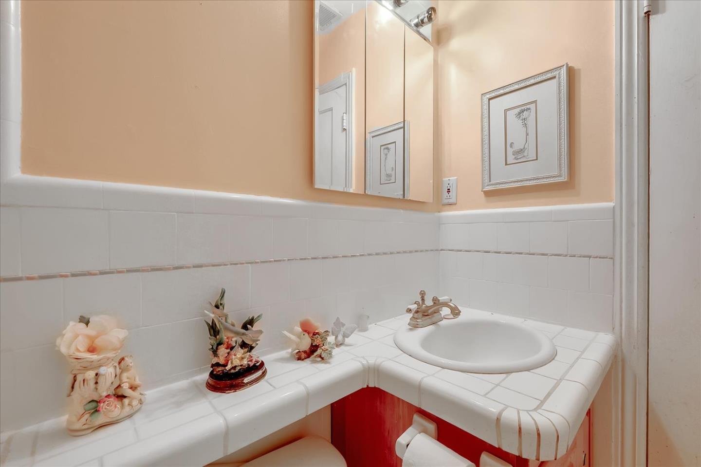 679 Sleeper Avenue Mountain View, CA 94040 - Photo 46 of 51 a bathroom with a sink and a mirror