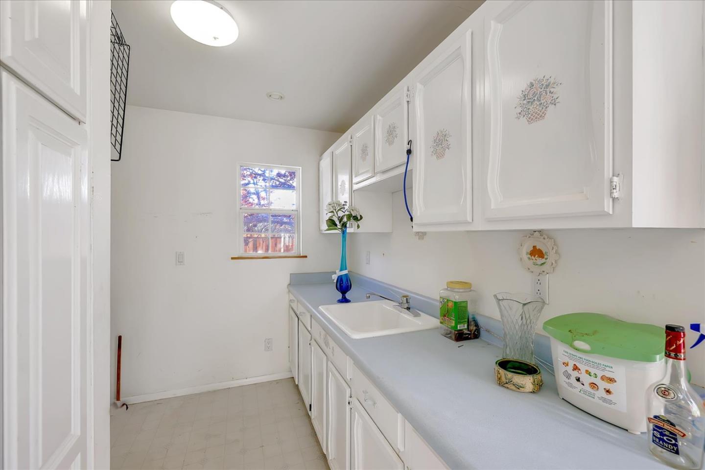 679 Sleeper Avenue Mountain View, CA 94040 - Photo 49 of 51 a kitchen with a sink cabinets and window