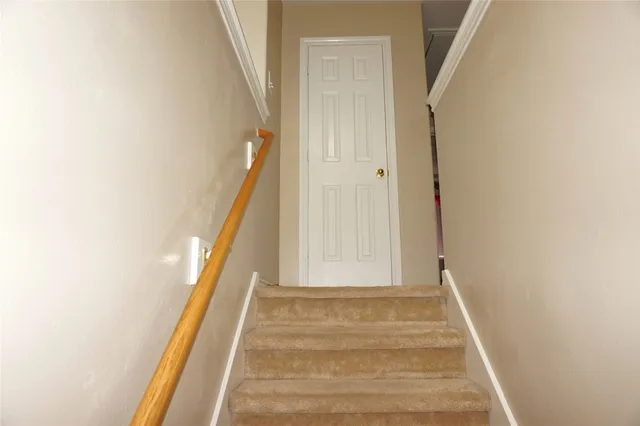 a white toilet sitting next to a bath tub