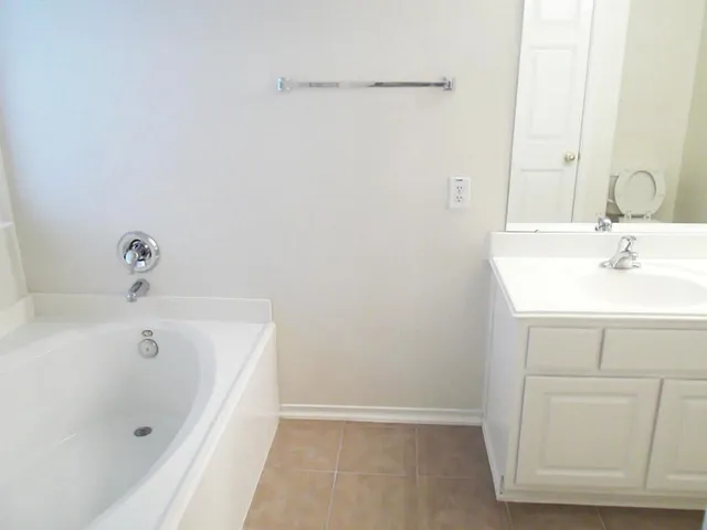 a bathroom with a shower and a tub