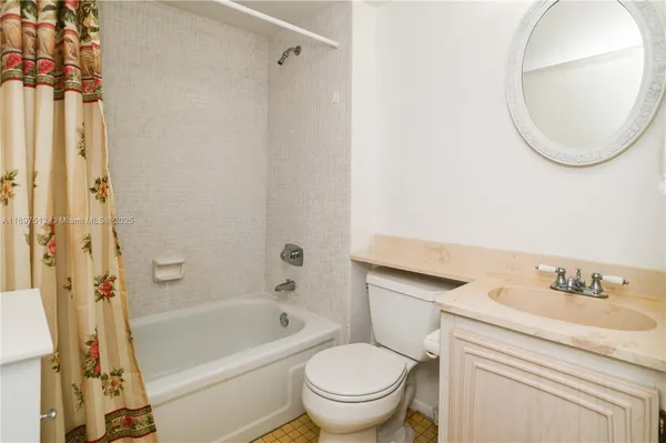 a bathroom with a sink a toilet and a bathtub