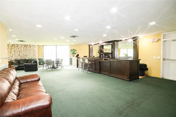 a view of a livingroom with furniture and chandelier