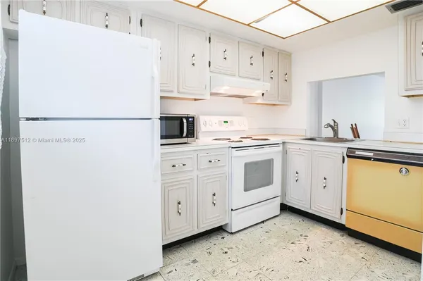 a view of kitchen with a sink