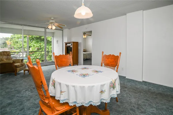 a room with a table and chairs