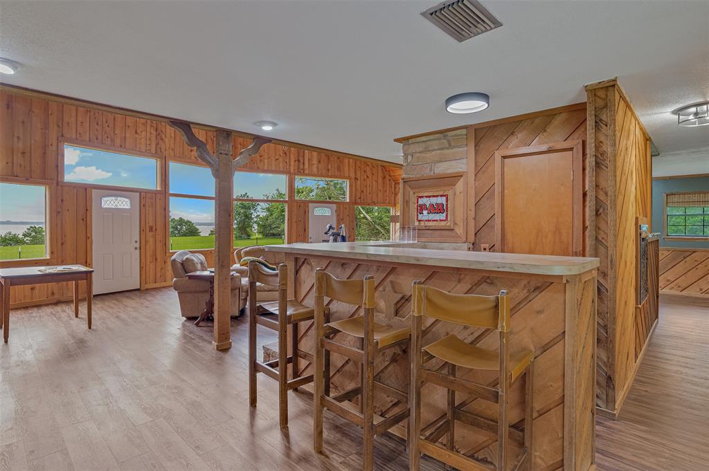 10307 Pirogue Road Oil City, LA 71061 - Photo 11 of 36 a dining room with furniture and a large window