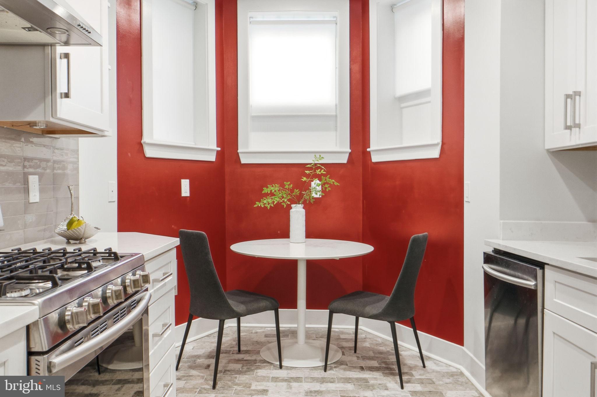 1126 5th Street Northwest, Unit 1 Washington, DC 20001 - Photo 12 of 27 a dining room with furniture and window