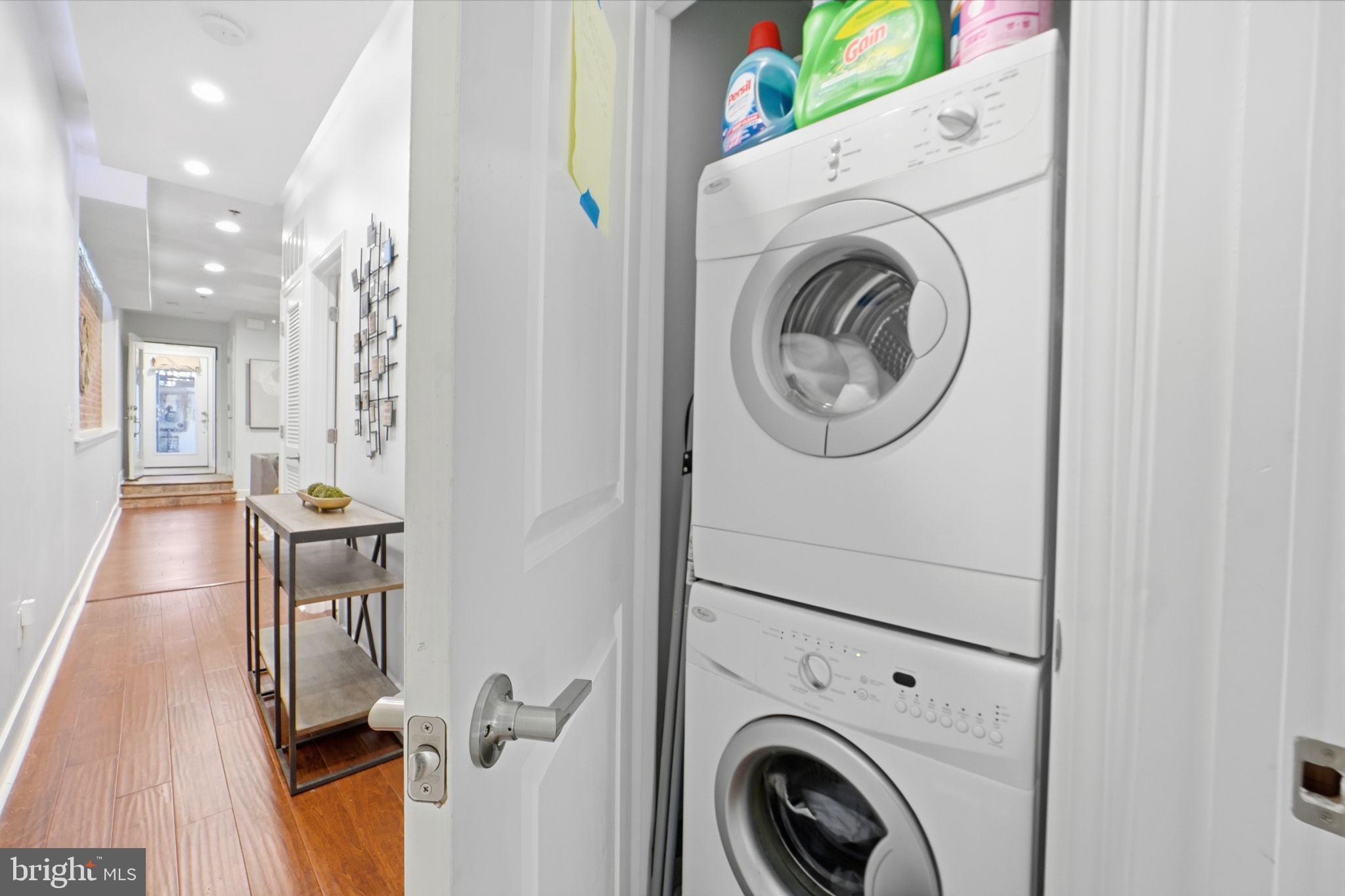 1126 5th Street Northwest, Unit 1 Washington, DC 20001 - Photo 16 of 27 a view of a hallway with washer and dryer