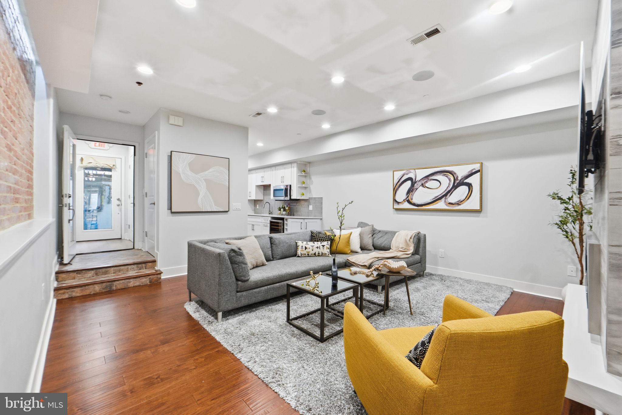 1126 5th Street Northwest, Unit 1 Washington, DC 20001 - Photo 5 of 27 a living room with furniture and wooden floor