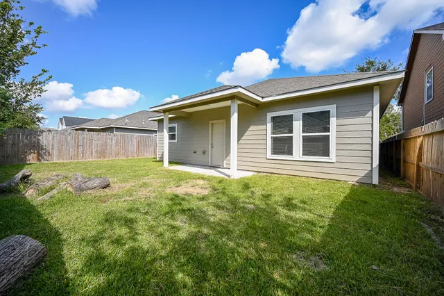 a house view with a backyard space