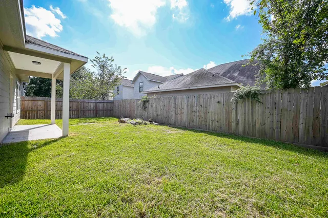 a view of a backyard with a small cabin
