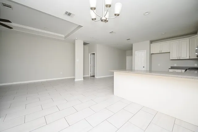 a view of kitchen with furniture and cabinets