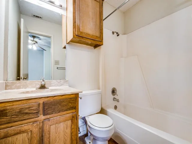 a bathroom with a sink a toilet and a bathtub