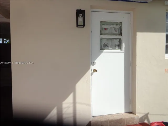 a view of house with backyard space and porch