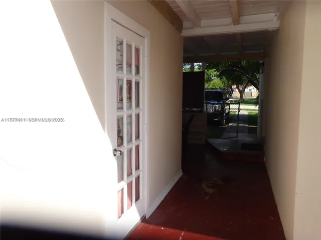 a bedroom with a bed and dresser