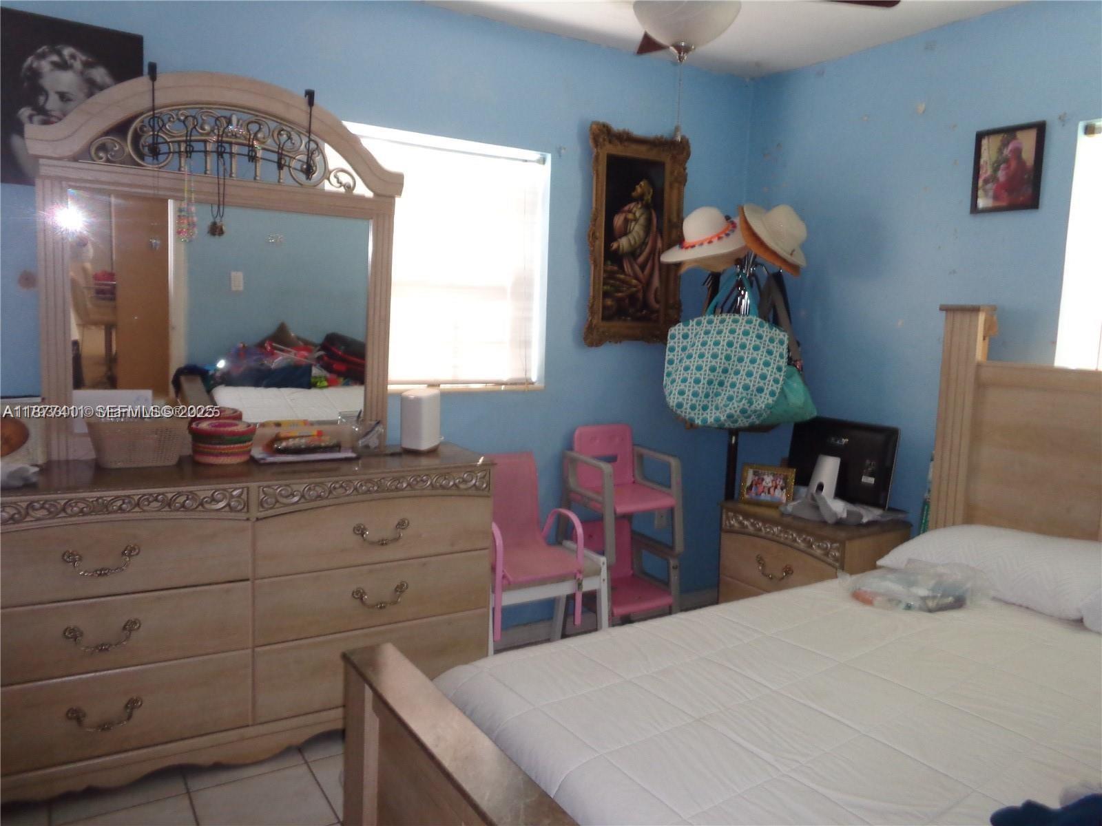 10020 Dominican Drive Cutler Bay, FL 33189 - Photo 8 of 22 a bedroom with a bed and dresser