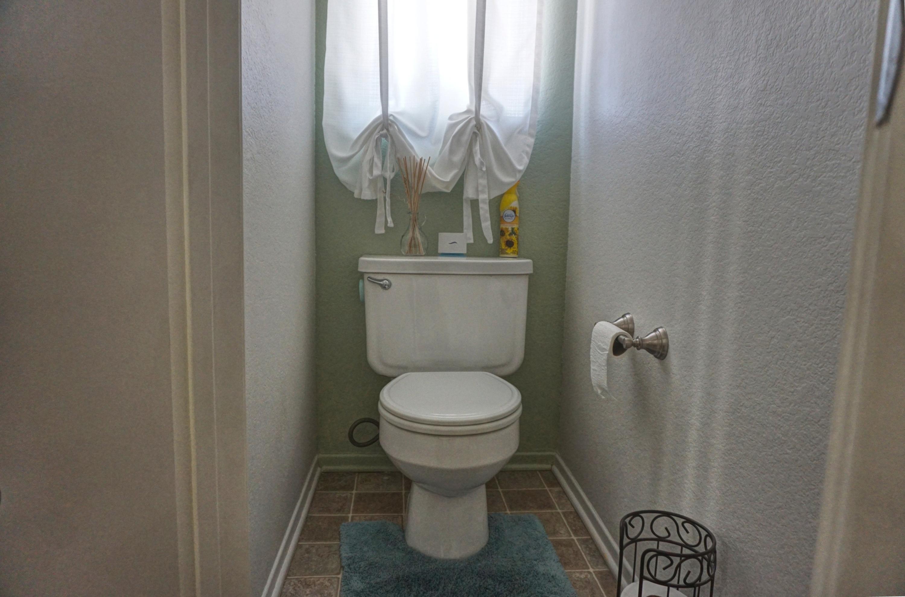 3165 Shale Road Palmdale, CA 93550 - Photo 14 of 23 a bathroom with a toilet and a sink